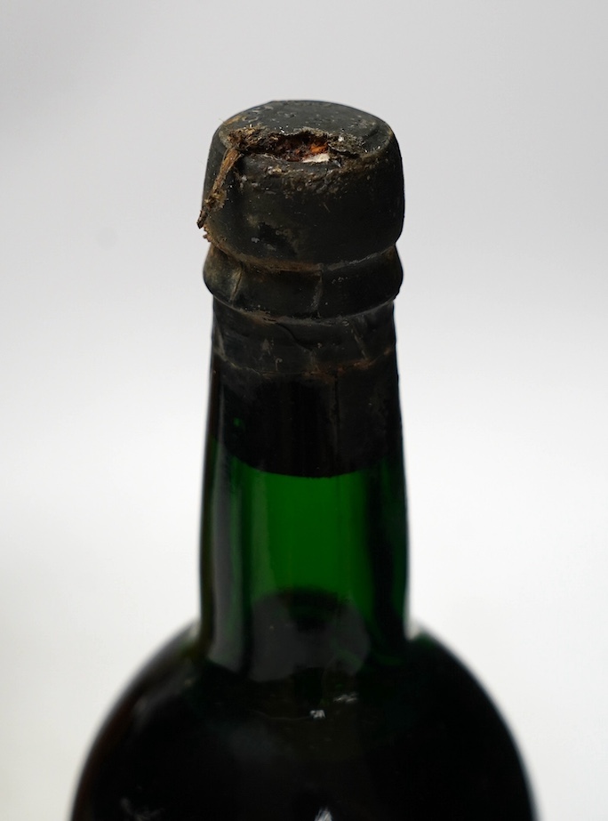 Four various bottles of alcohol to include a bottle of Taylor’s 1966 vintage port, another 1960 vintage port (label corroded), a bottle of J.de Malliac Bas Armagnac Extra Hors D’Age No.12440 and a bottle of Linie Aquavit
